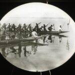 Two parallel canoes race each other