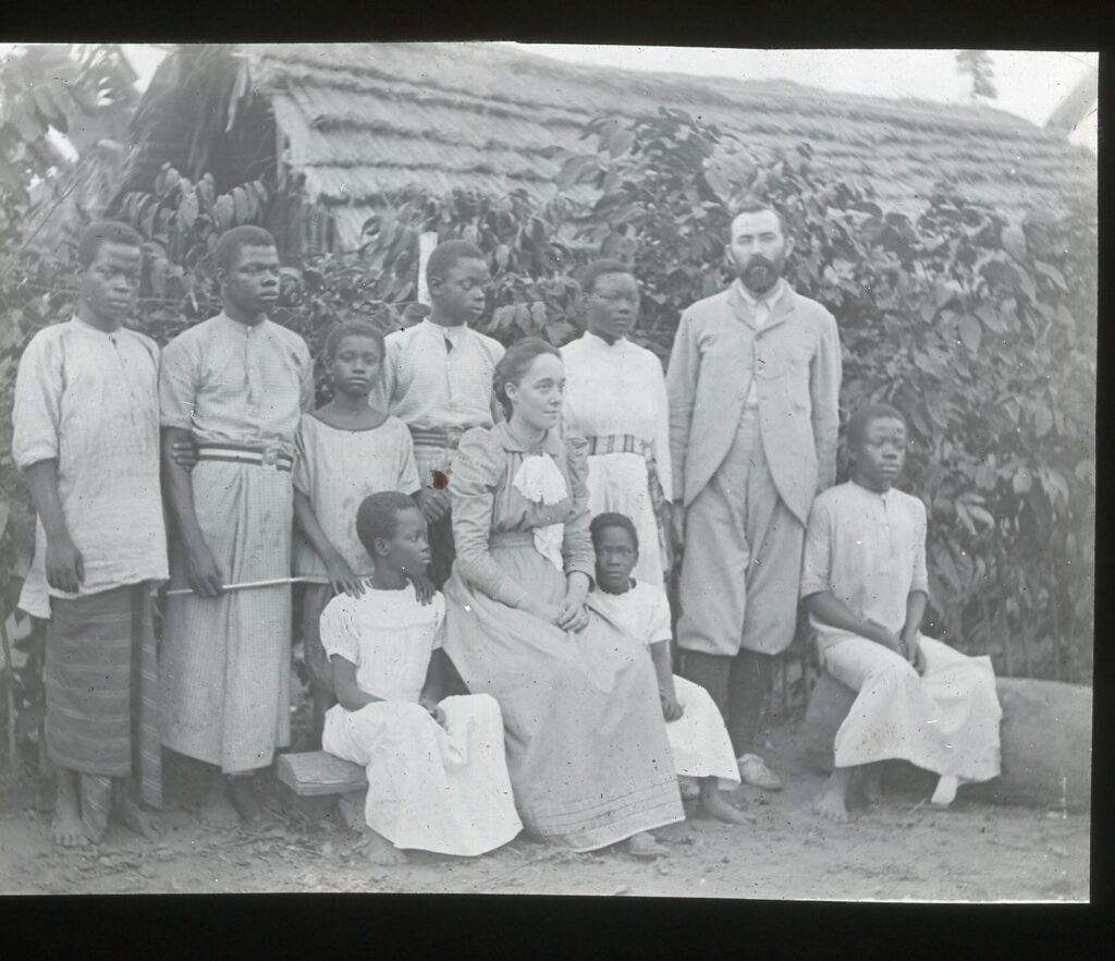 Mr and Mrs Scrivener with local boys and girls