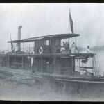 View of a double-decked steam paddle ship