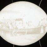 A large rowing boat with Reverend and Mrs Scrivener on board