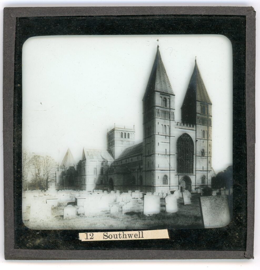Slide showing the relatively simply decorated gothic cathedral of Southwell as viewed across a graveyard