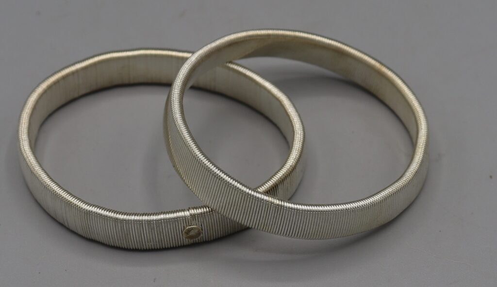 Pair of silver metal expanding armbands