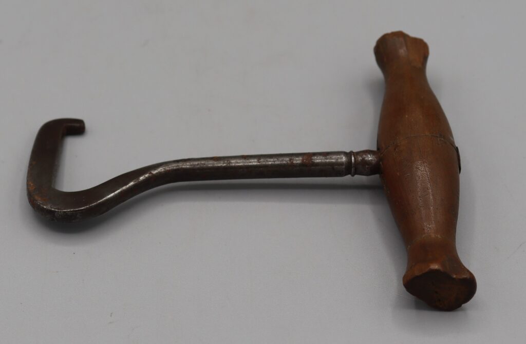 Metal boot puller with wooden handle