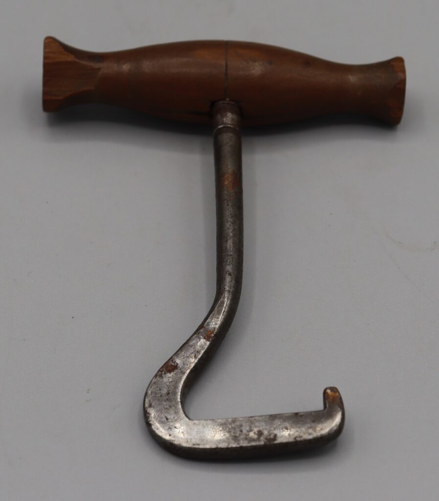 Metal boot puller with wooden handle
