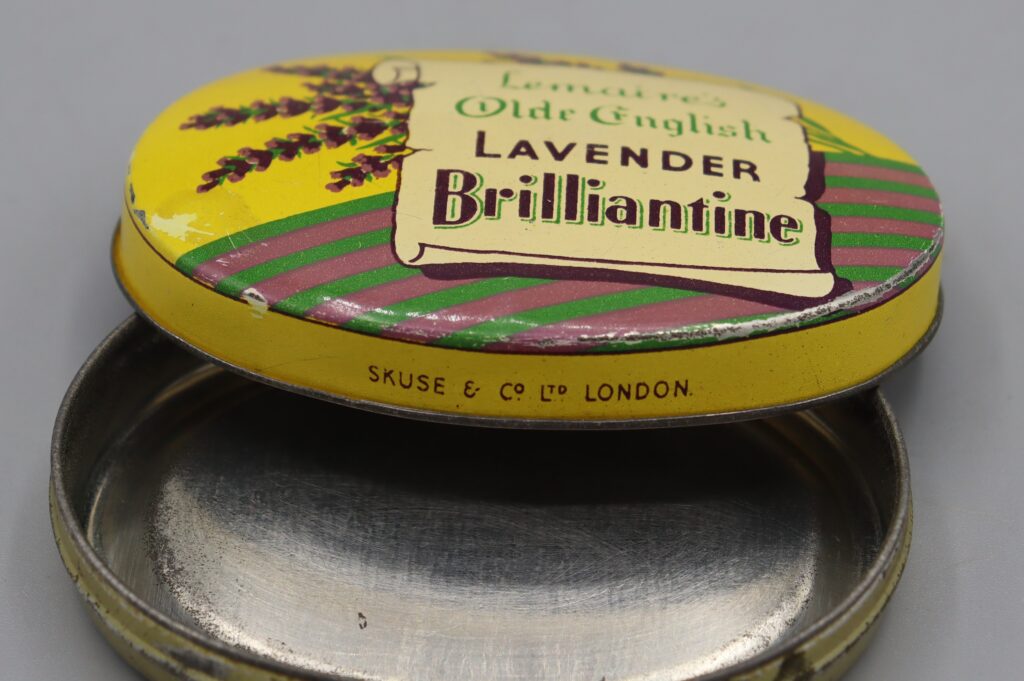 Oval metal tin view with lid open