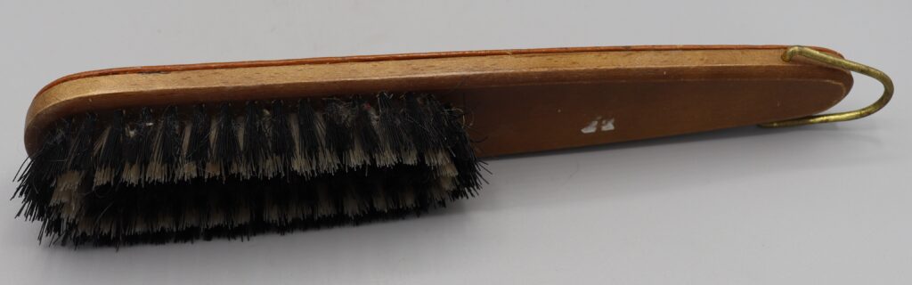 Wooden clothes brush, side view