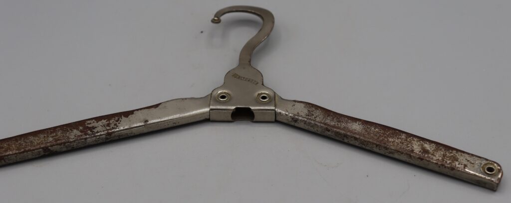 Folding coat hanger, fully opened, close-up view