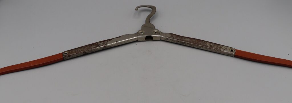 Folding metal clothes hanger, fully opened