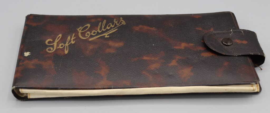 Brown leatherette collar holder, full view, closed