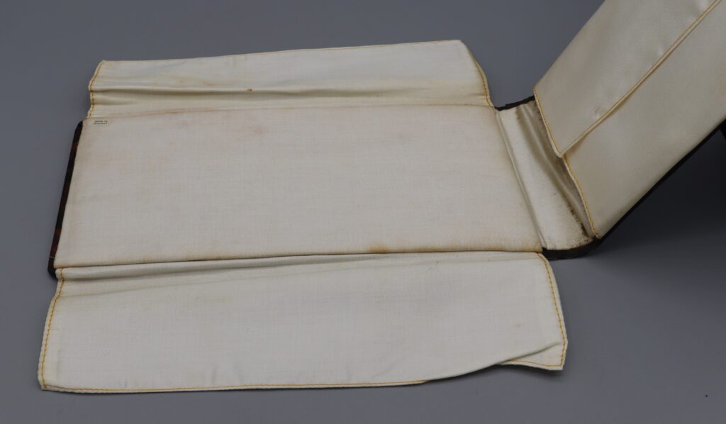 Collar holder, open to display lining, close-up view