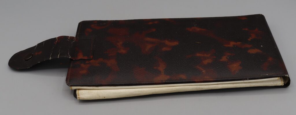 Brown leatherette collar holder, back view, closed