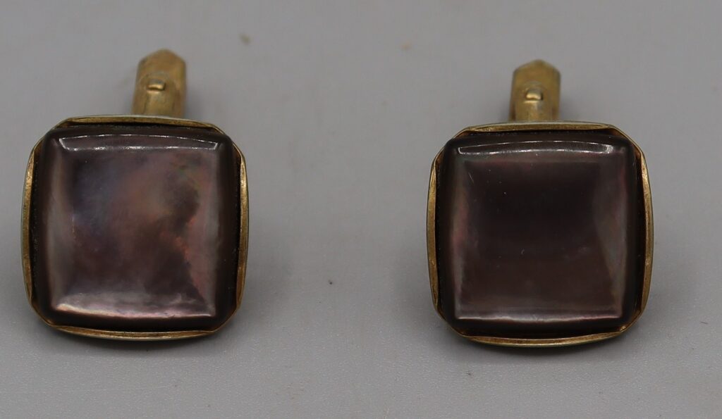 Pair of cufflinks, grey opalescent square face