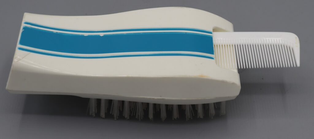 Brush and comb set showing the comb fitting into the brush