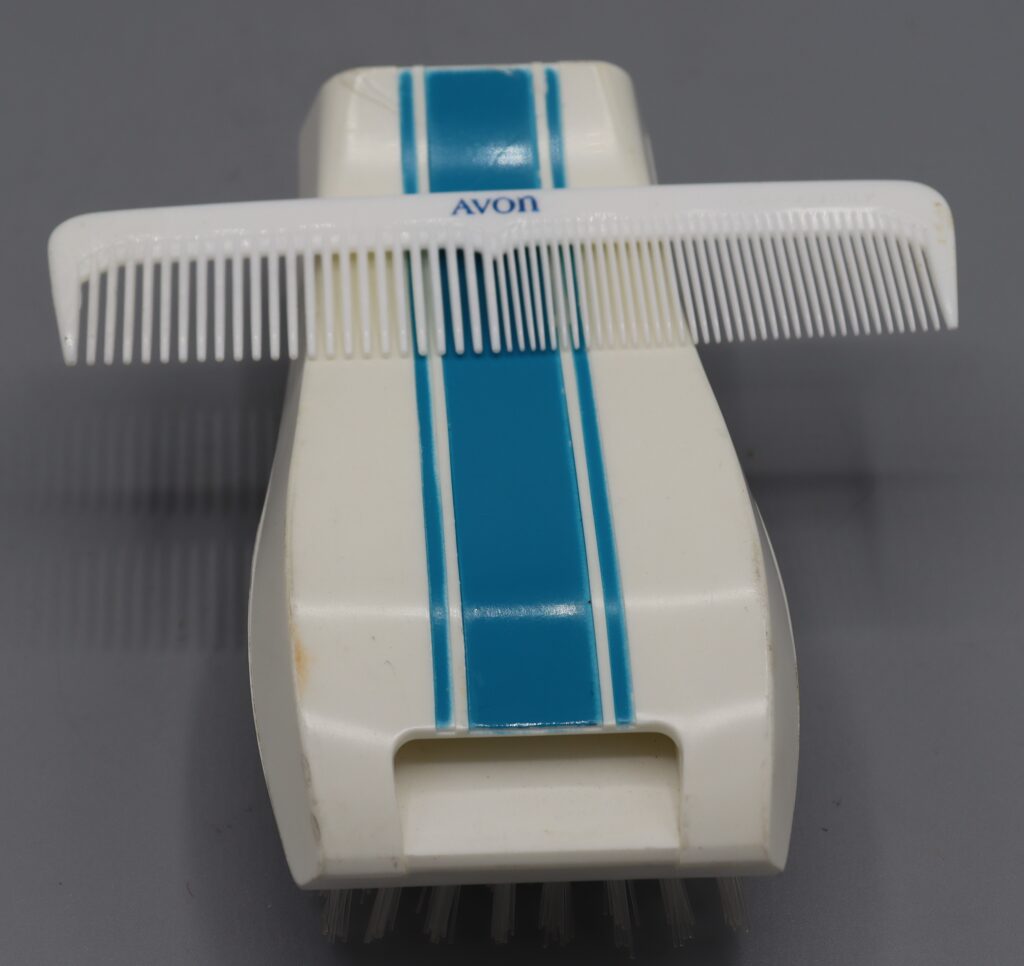 Hairbrush and comb set by Avon cosmetics, white and blue plastic