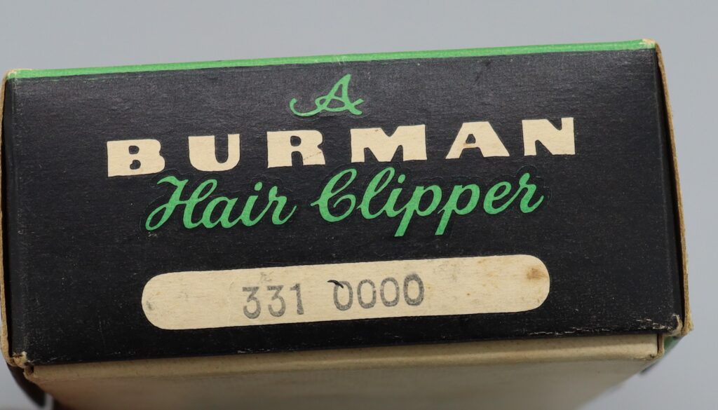 Top view of box for hairclippers showing manufacturer's name and serial number