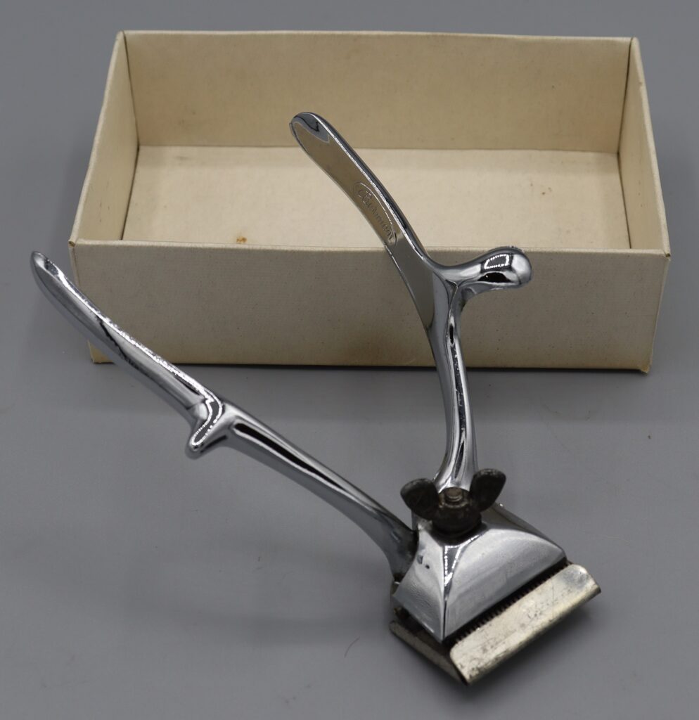 Hairclippers made by Burman and Sons, shown next to original cardboard box