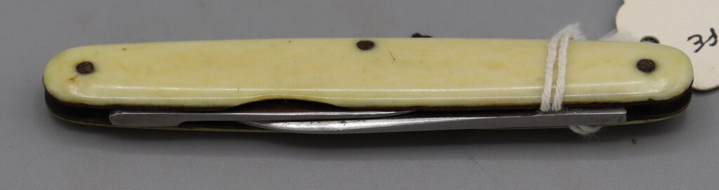 Penknife with ivory handle, shown in closed position