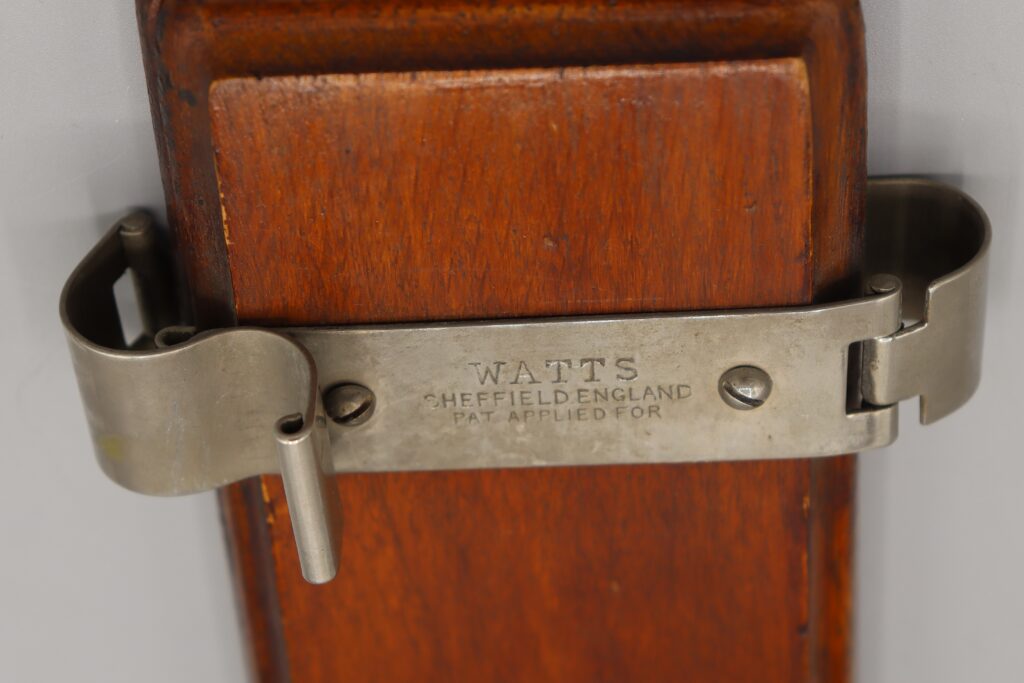 Detail of tie press by Watts showing manufacturer's name
