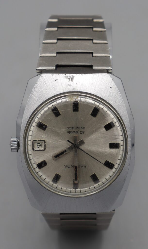 Man's wristwatch, close up view of face