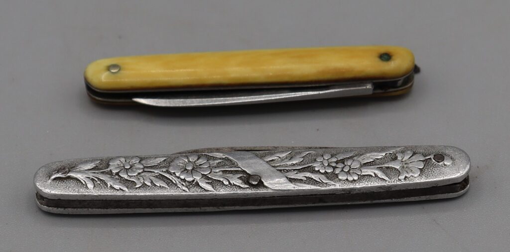 Two small penknives, shown folded