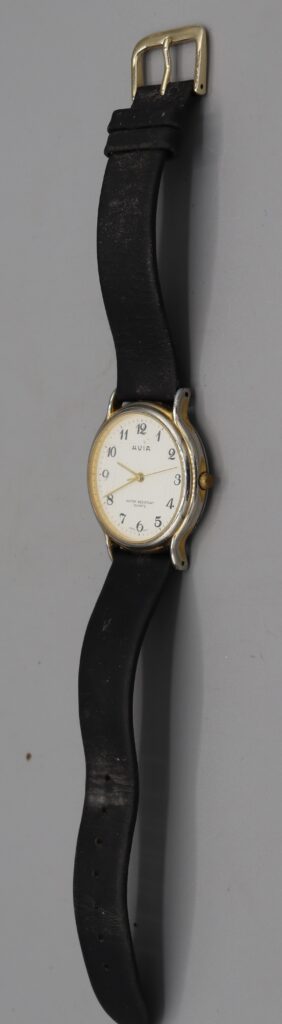 Man's wristwatch on leather strap