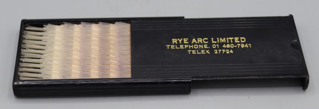 Fold-up hairbrush, shown in its box