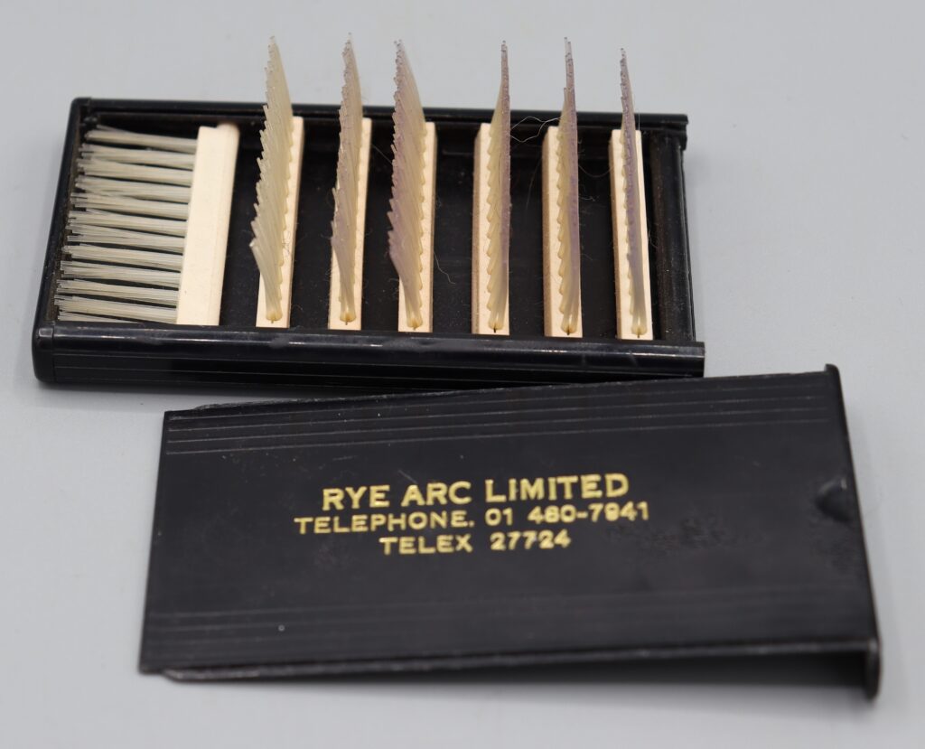 Fold-up hairbrush, shown with bristles raised