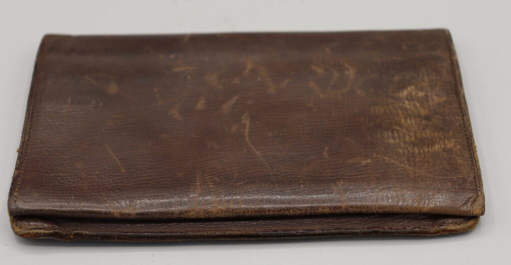 Brown leather wallet, shown closed