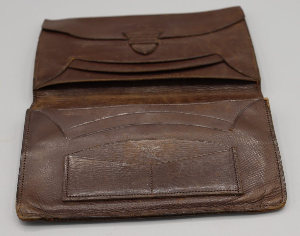 Brown leather wallet shown open