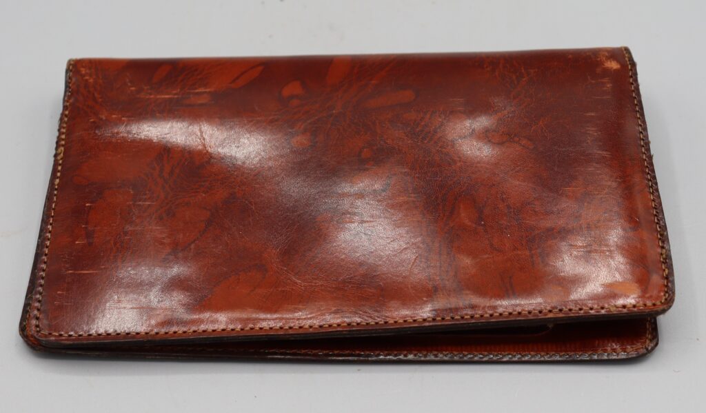 Leather wallet shown closed