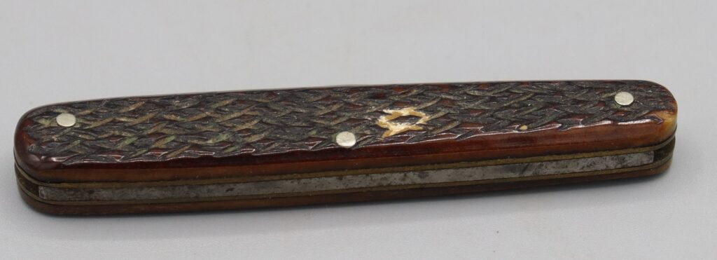 Twin blade penknife, shown closed, back view