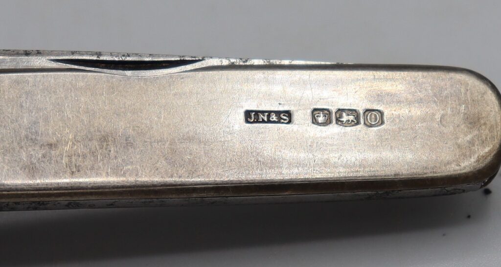 Silver penknife, close-up showing the hallmarks