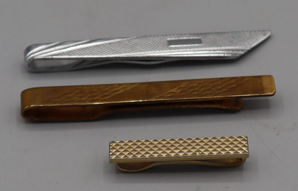 Three tie clips, front view