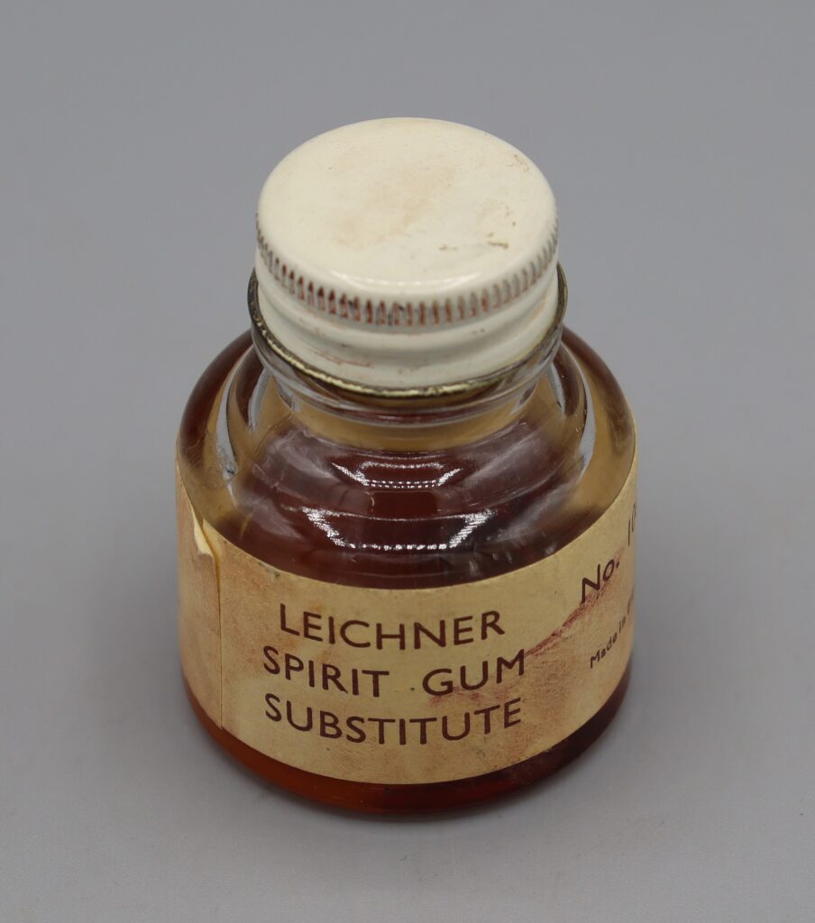 Screw-top glass jar showing front part of label