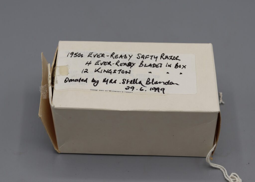 White cardboard box containing 12 spare blades