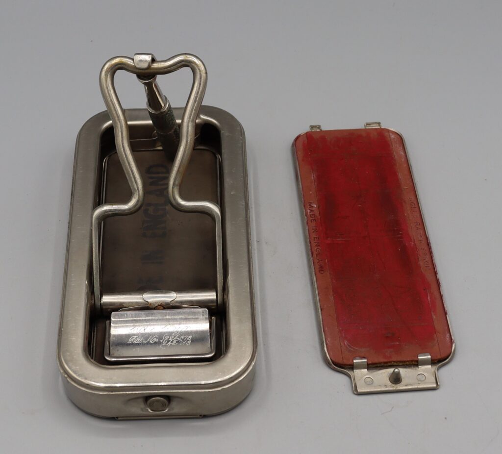 Rolls razor in open box handle half open with sharpener .