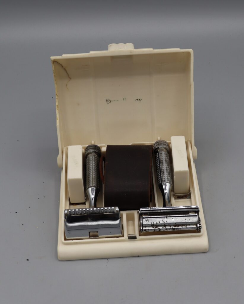 two everready razors spare blades & strop in open carry case.