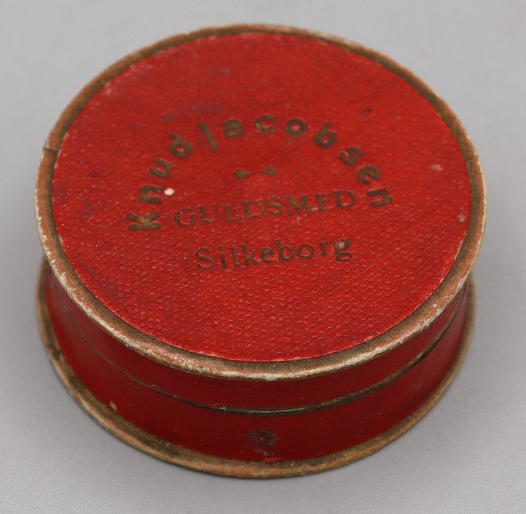 red jewellery box, enlarged