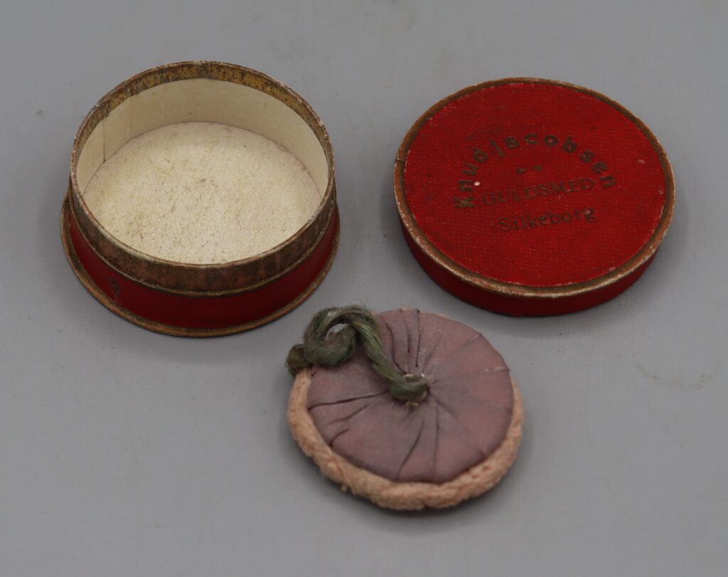 jewellery box with mauve powder puff