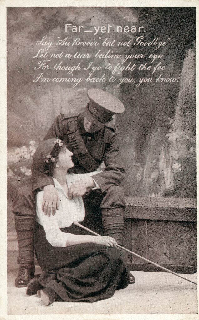 Front of an Edwardian postcard showing a black and white image of a soldier holding a woman with a poem titled 'far, yet near'