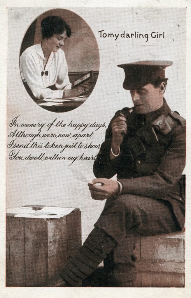 Front of an Edwardian postcard with a coloured image of a soldier reading a letter, with a poem titled 'to my darling girl'